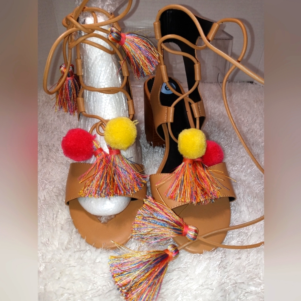 Rebecca Minkoff lace up faux leather sandal with pompom detail. Never wo…